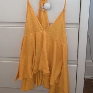 Yellow peplum v-cut tank
